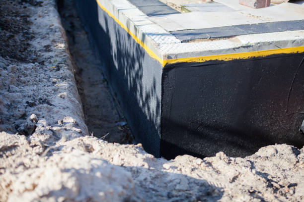 Professional Waterproofing technician working in Reed City, MI